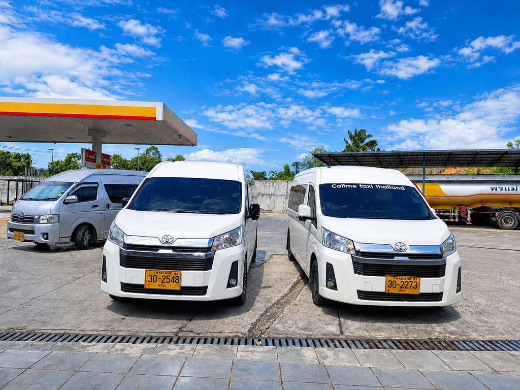 Three Toyota passenger vans parked at a petrol station, including a Callme Taxi Thailand van