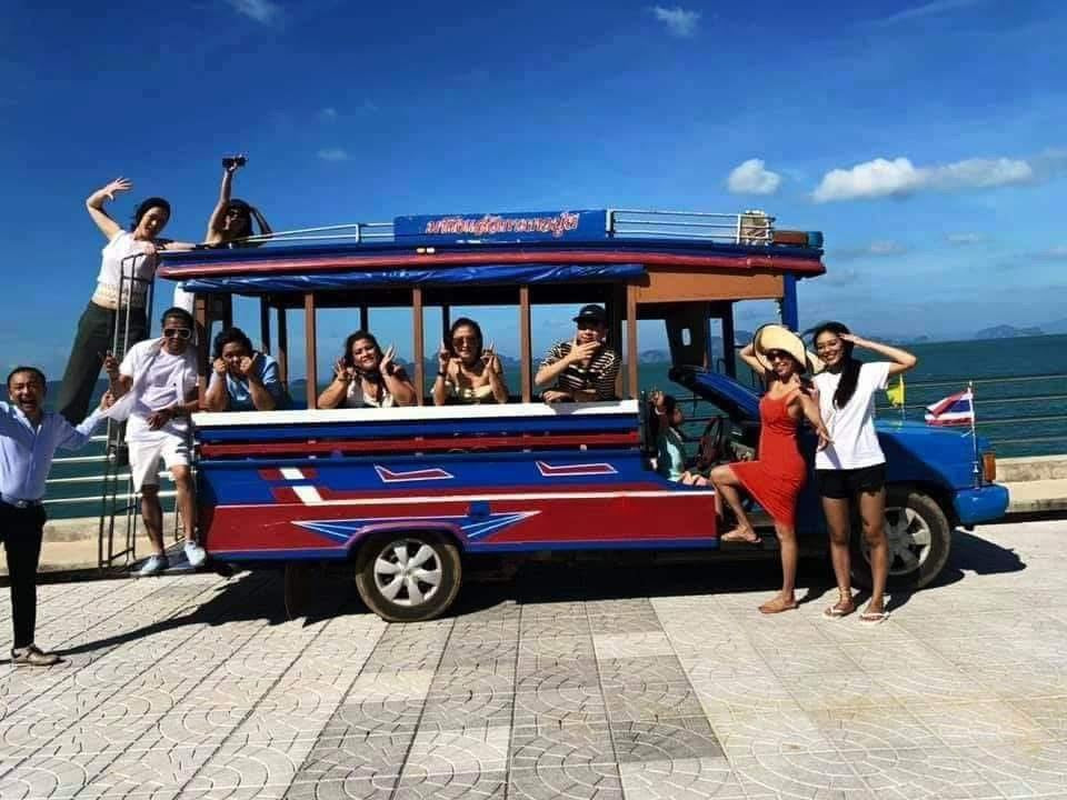 Colourful shared transfer boat at Manoh Pier, Koh Yao Noi with passengers