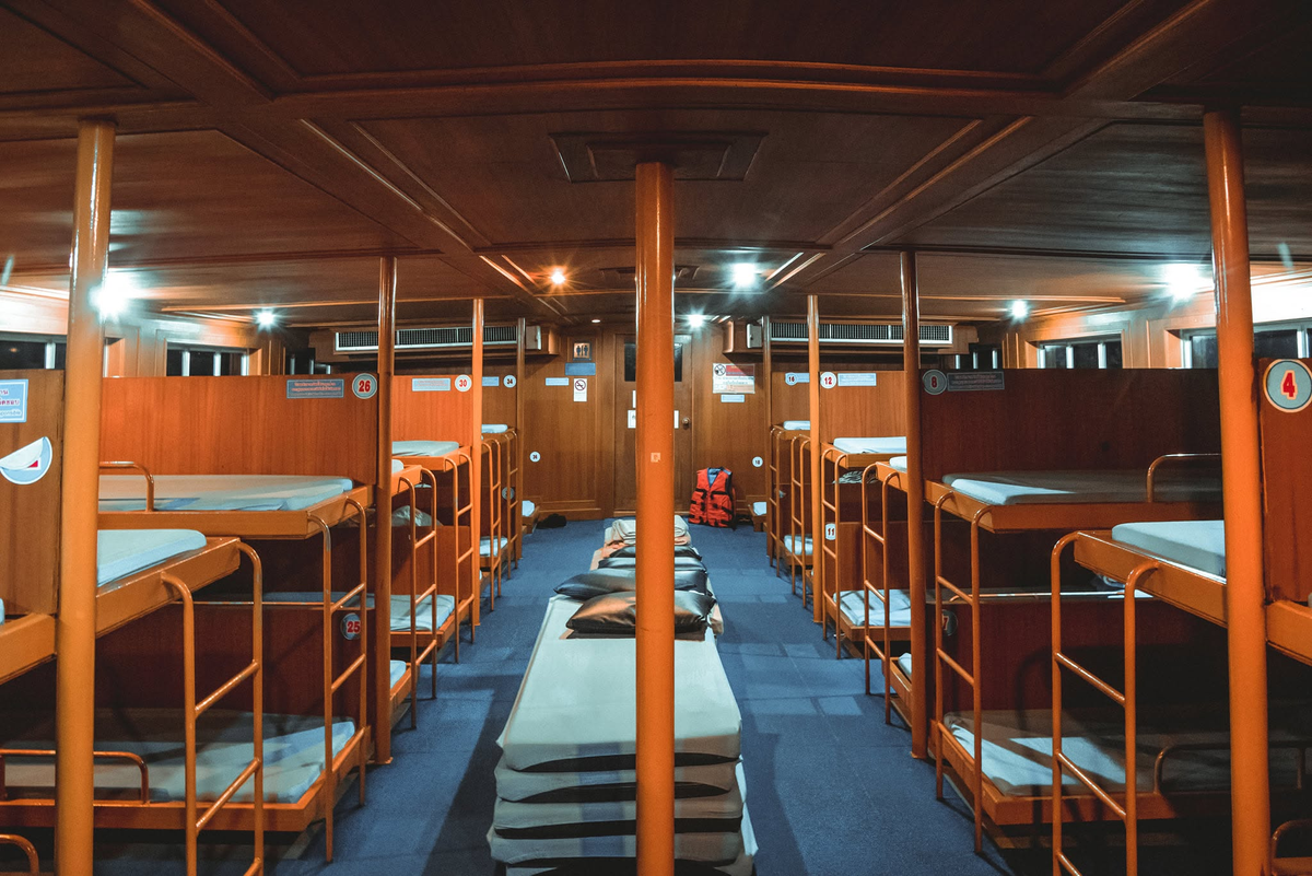 Sleeping area with bunk berths aboard a Ko Jaroen night ferry; boat assigned to a booking may vary